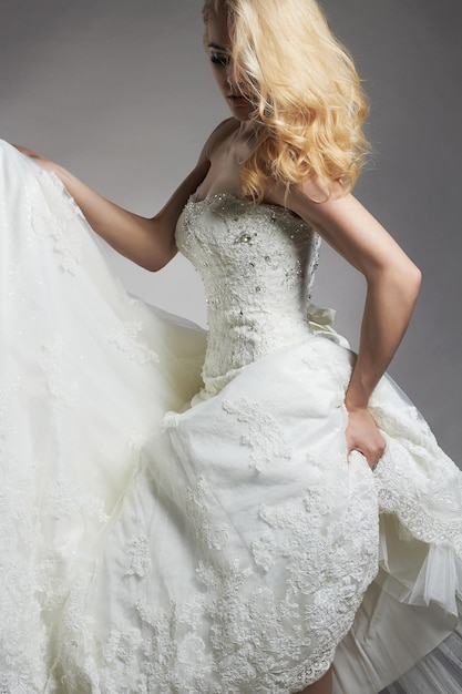 Dancing bride woman in wedding dress