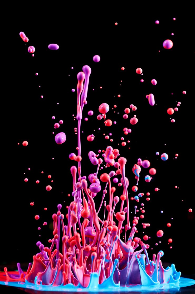 Photo dancing colored paint. abstract sculpture dye. splash of ink on a black background