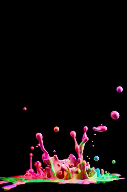 Photo dancing colored paint. abstract sculpture dye. splash of ink on a black background
