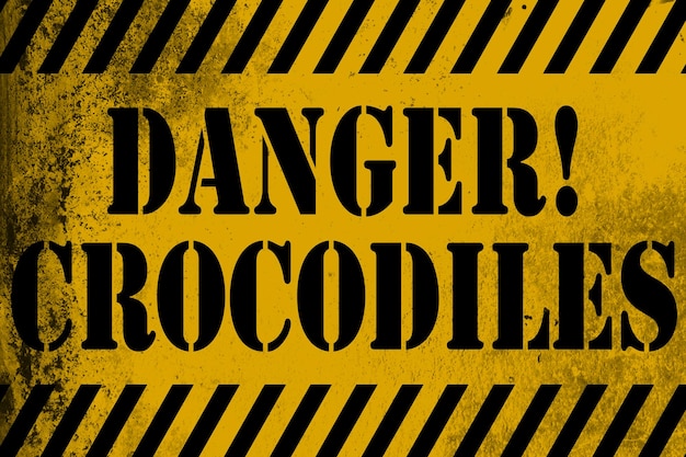 Photo danger crocodiles sign yellow with stripes