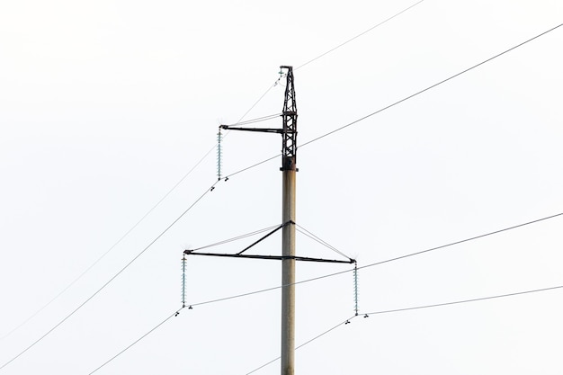 Danger of electric shock. Pole with wires