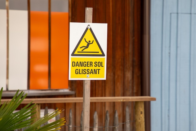 danger sol glissant french text sign means slippery floor danger on yellow panel