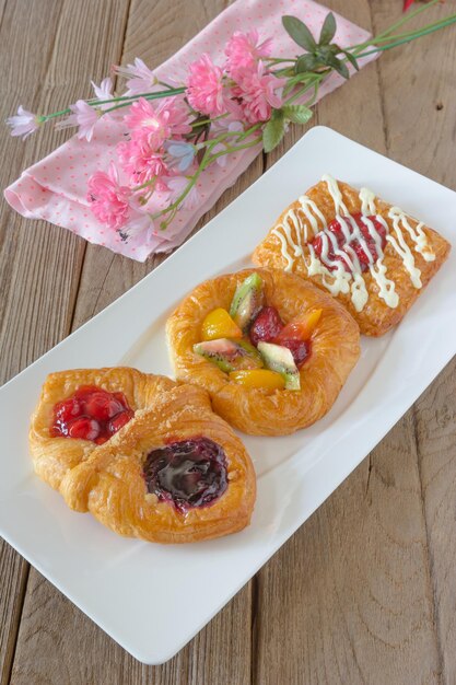 danish pastry with fruits on white dish