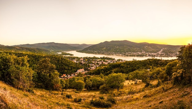 Danube bend in Hungary with Visegrad castle in the back and a stunning sunset photographed from Domos Hungary