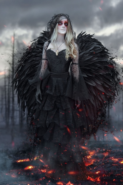 A dark angel walks on scorched earth