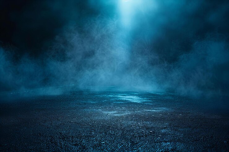 Photo a dark background with a blue light shining on it