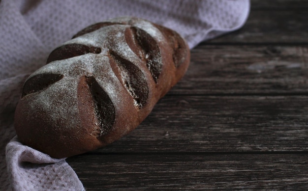 Dark beautiful rye bread on a wooden background