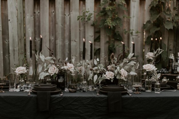 Photo dark and beautifully styled dining arrangement