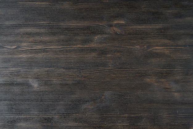 Dark black brown texture wooden background pattern.