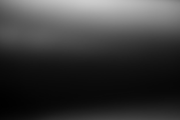 Photo dark black and gray blurred gradient background has a little abstract light