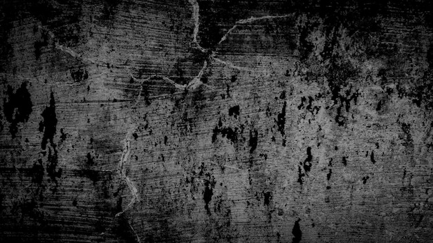 暗い黒グランジひびの入った壁の背景