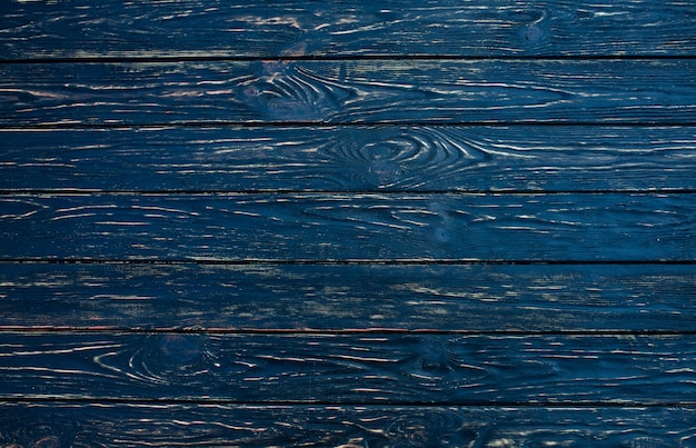 Dark black wood texture background viewed from above. 