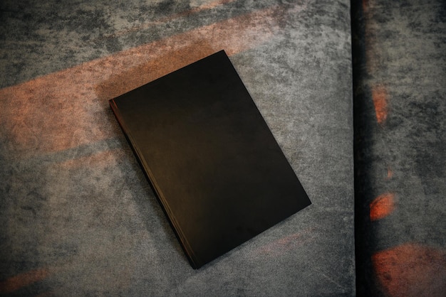 Photo dark blank portfolio cover on suede background