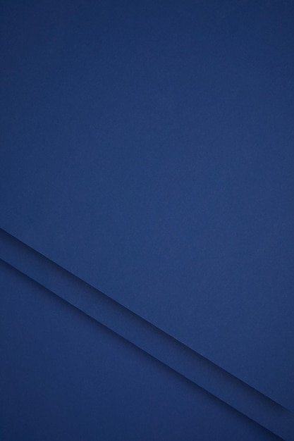 dark blue abstract background from colored paper