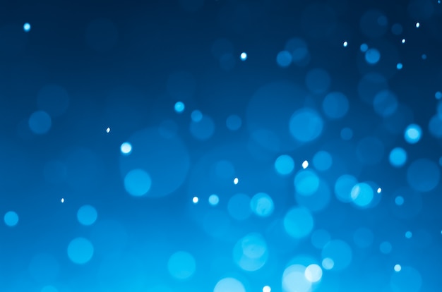 ダークブルーの抽象的な背景とbokeh。
