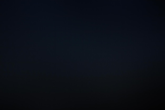 Dark blue background with black vignette and copy space for text