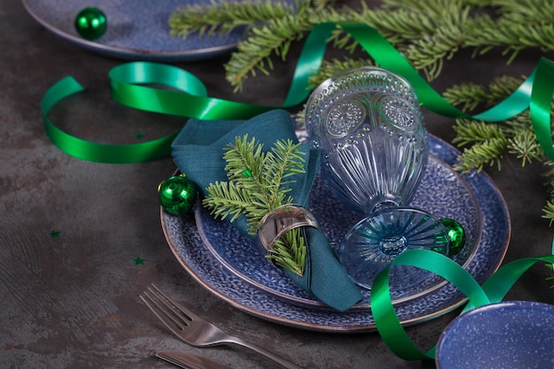 Dark blue christmas decoration with firtree branch