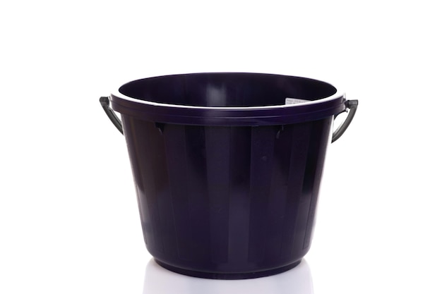 Dark blue plastic empty bucket on white background