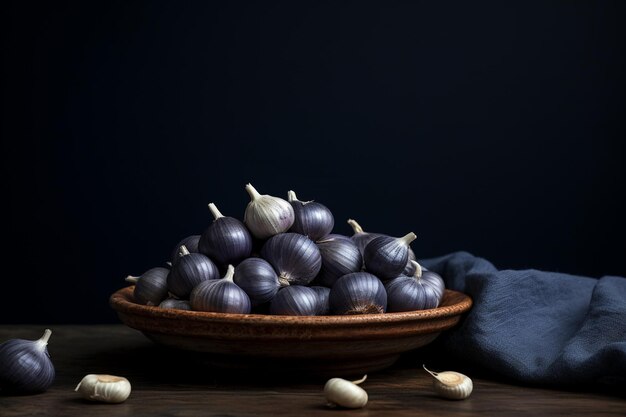 A dark blue plate with garlic on a gray background