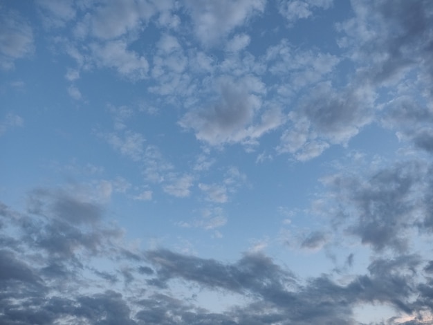 Dark blue sky with clouds background