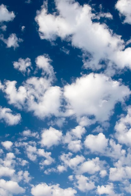 Dark blue sky with white clouds