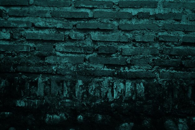 A dark brick wall with a green background that says'the word brick '