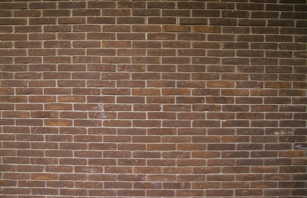 ダークブラウンのレンガの壁テキスト用の空のスペース抽象的な背景とテクスチャ