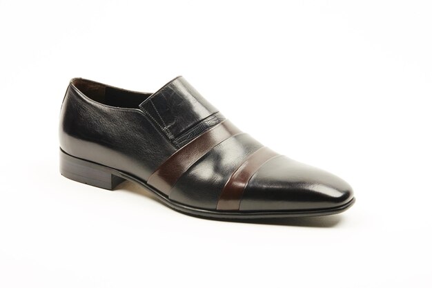 Dark brown classic leather mens shoes on a white isolated background.