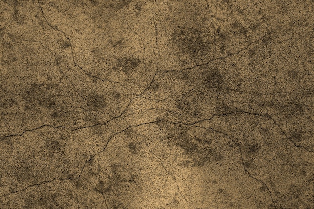 Dark brown color random cracked old concrete wall with heavy grunge texture for background