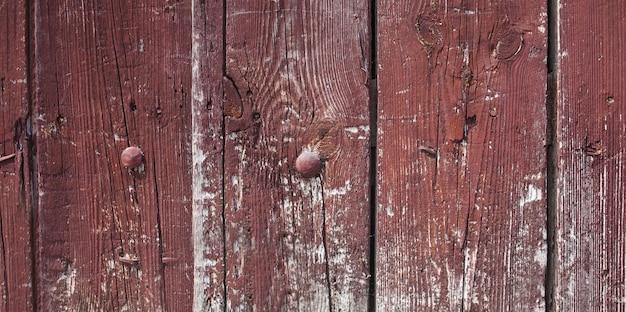 Dark brown scratched wooden board.