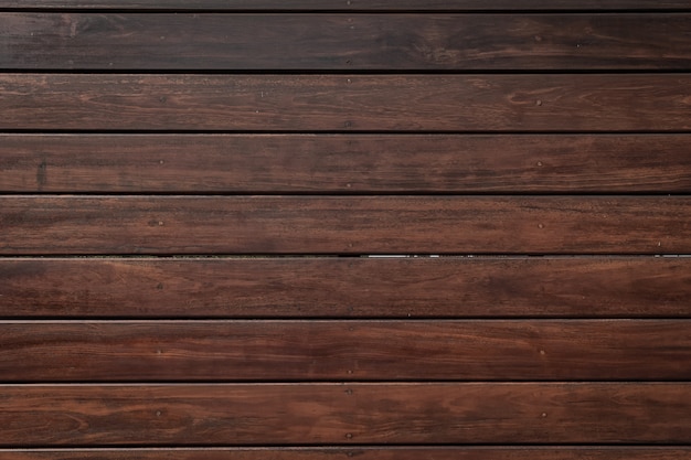 Fondo di legno marrone scuro, tavole di legno.