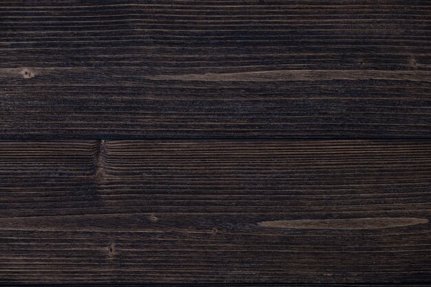 Dark brown wood texture with natural striped pattern background 