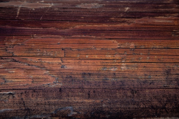 dark brown wood with bumps and ripples