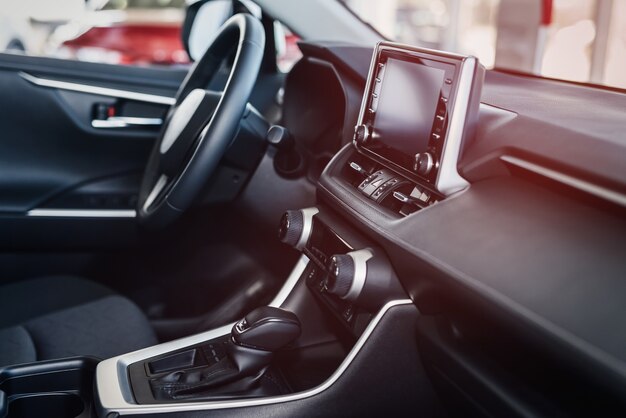 Dark car interior close up at showroom