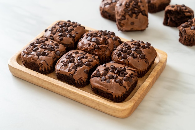 dark chocolate brownies with chocolate chips on top