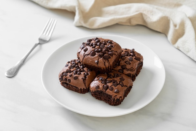 dark chocolate brownies with chocolate chips on top