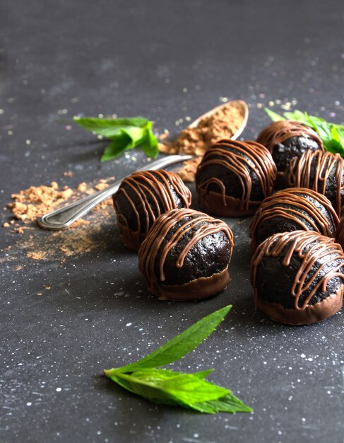 Dark chocolate candies on dark background chocolate truffles