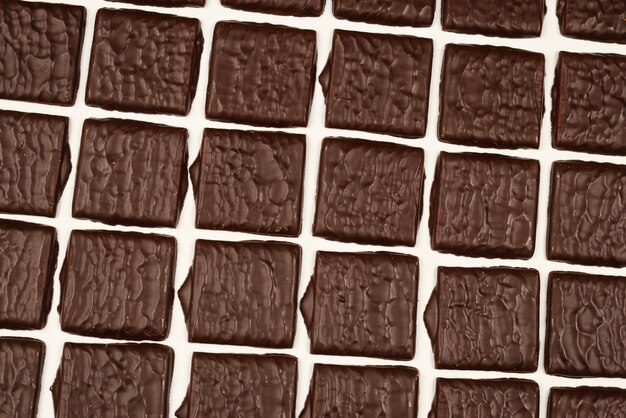 Dark chocolate candies isolated on a white background.