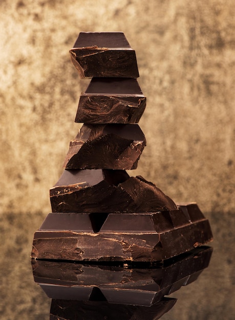 Dark chocolate on a stone background