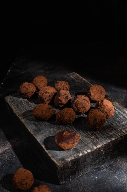 Dark chocolate truffle on dark background