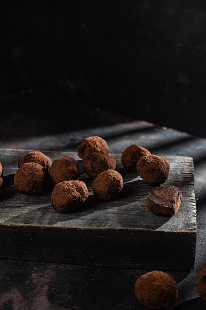 Dark chocolate truffle on dark background