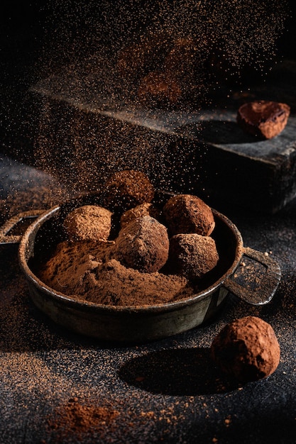 Dark chocolate truffle on dark background