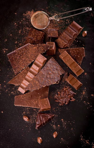 Dark chocolate over wooden background