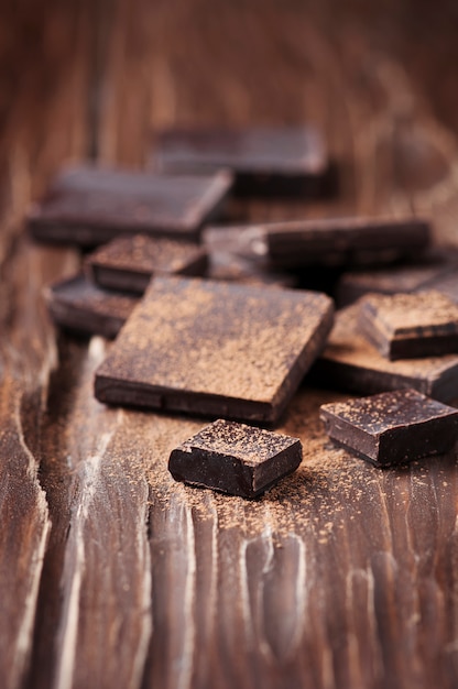 Dark chocolate on the wooden table