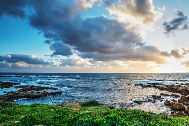 Dark clouds over the sea at sunset in Sardinia Italy