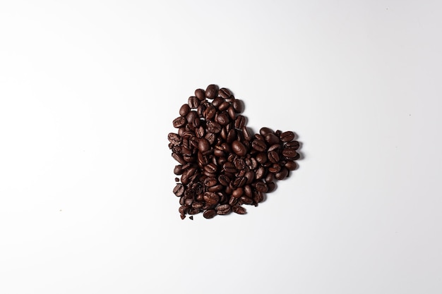 Dark coffee beans in heart shape