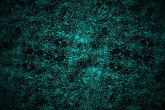 Dark cyan color rough concrete surface background of scattered grunge texture