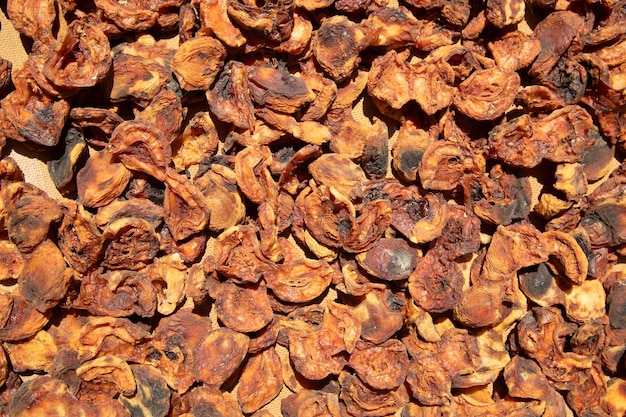 Dark dried apricots background Healthy food