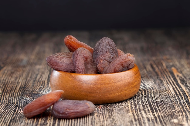 Dark dried apricots of large size