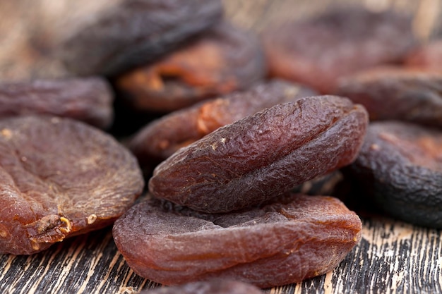 Dark dried apricots of large size